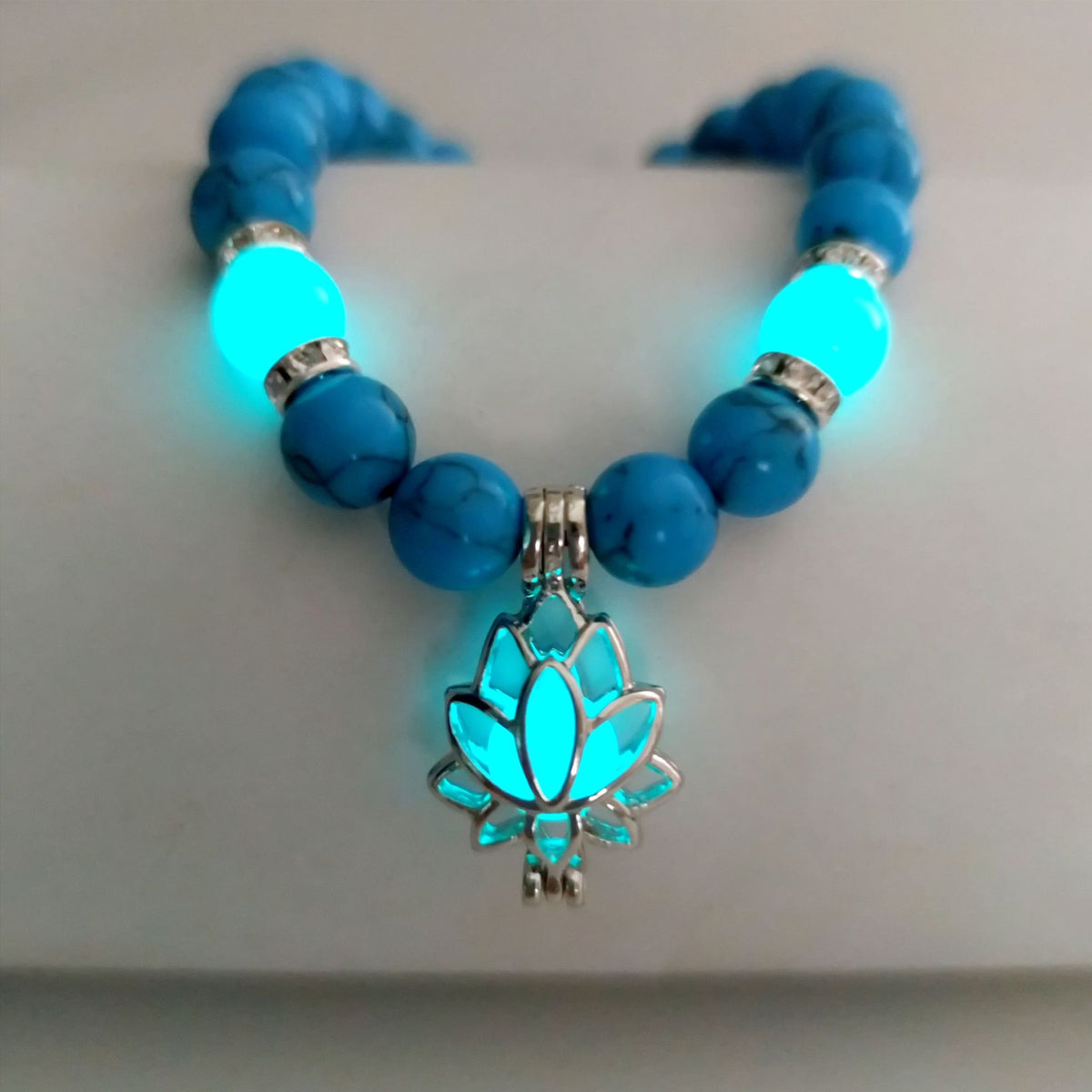 Turquoise Bead Bracelet with Lotus and Sanskrit Design