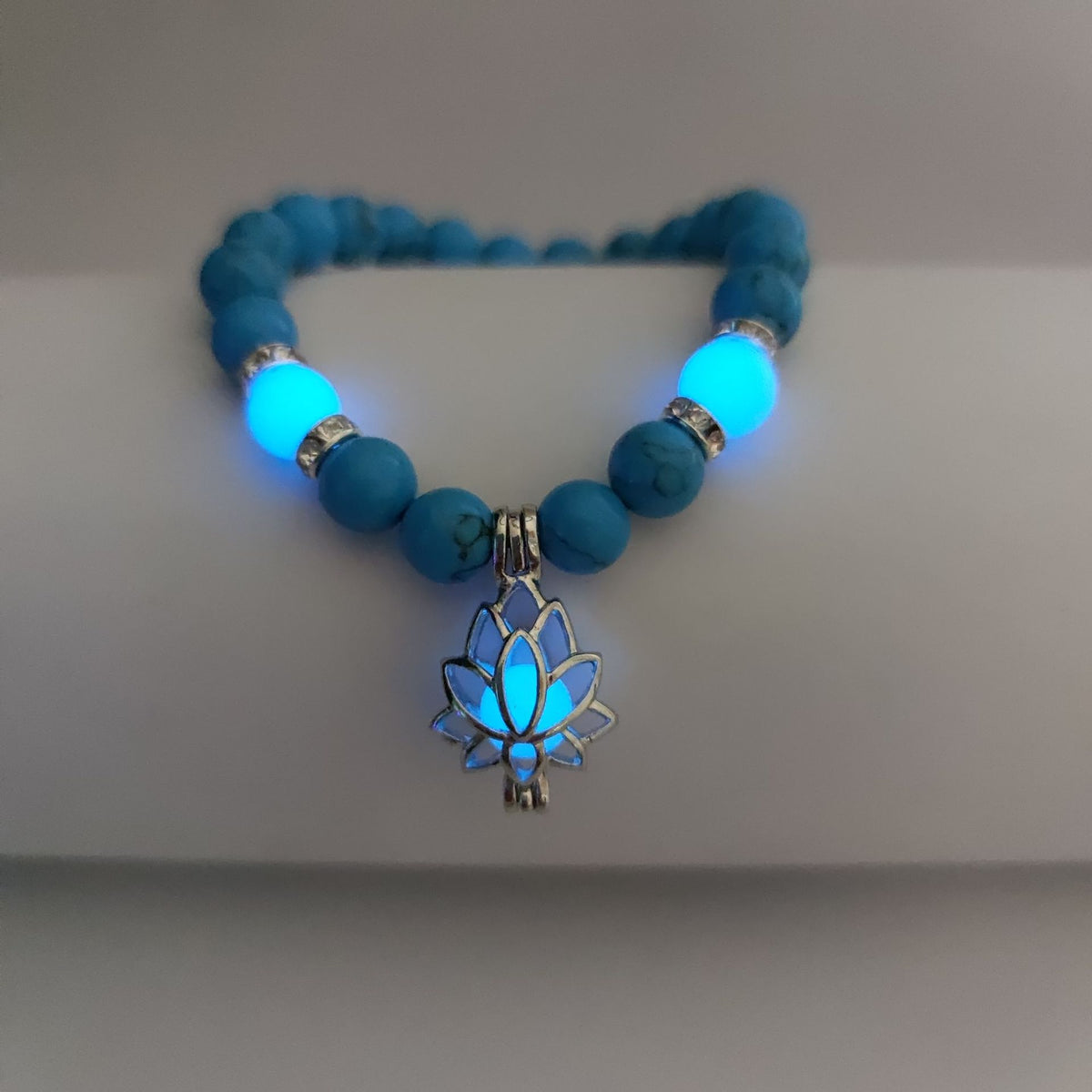 Turquoise Bead Bracelet with Lotus and Sanskrit Design