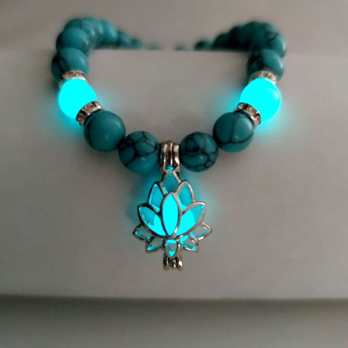Turquoise Bead Bracelet with Lotus and Sanskrit Design