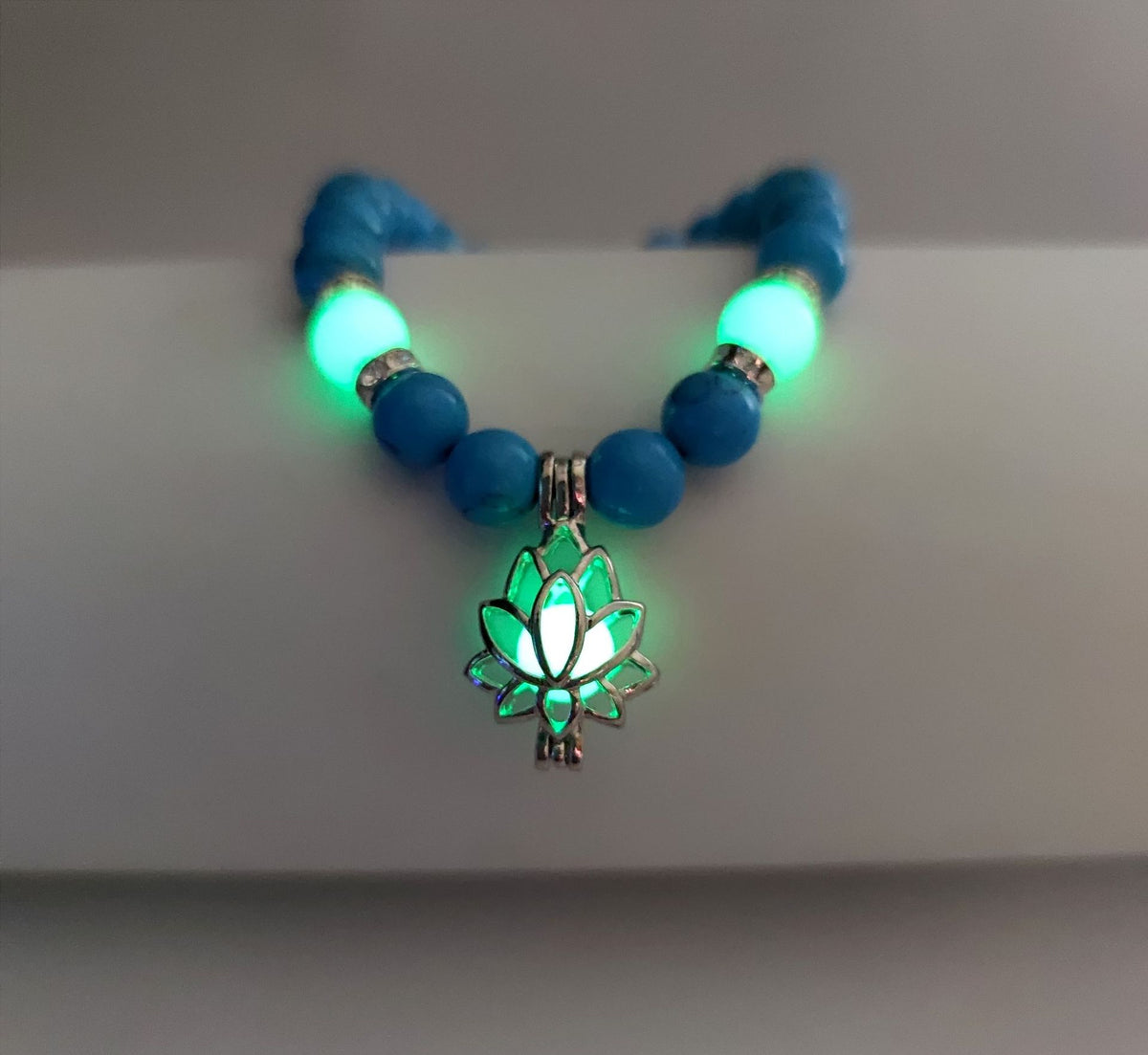 Turquoise Bead Bracelet with Lotus and Sanskrit Design